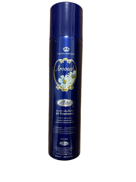 A blue Aroosah can of Crown Princess Aroosal air freshener placed on a light brown wooden surface.