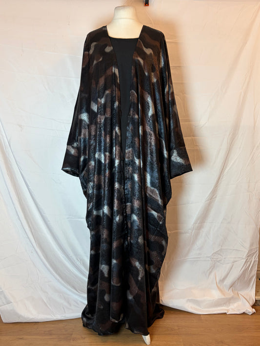 Black patterned Abaya Kimono on a white surface