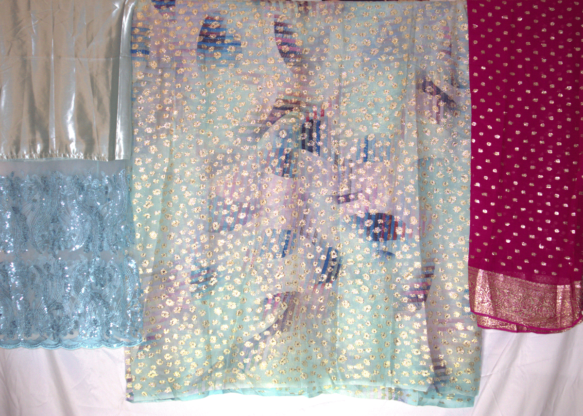 Colorful somali dirac fabric with patterns and textures on a white background