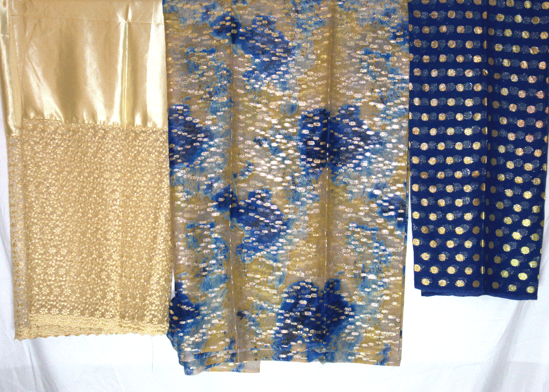 Three piece Dirac Fransawi fabric in gold, blue, and gold with white dots on a white background