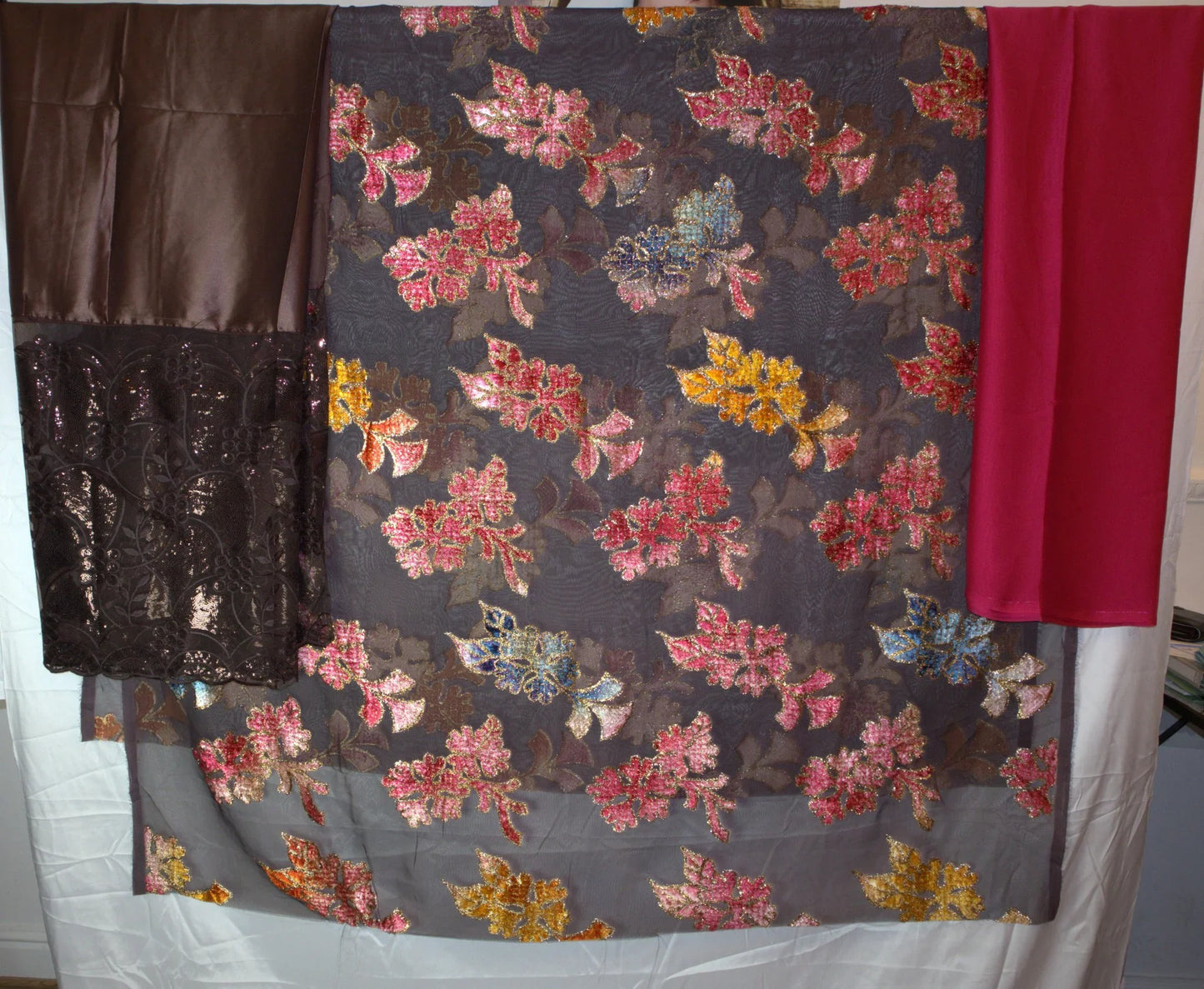 Drac - Floral patterned fabric with brown, red, and yellow colors on a white background