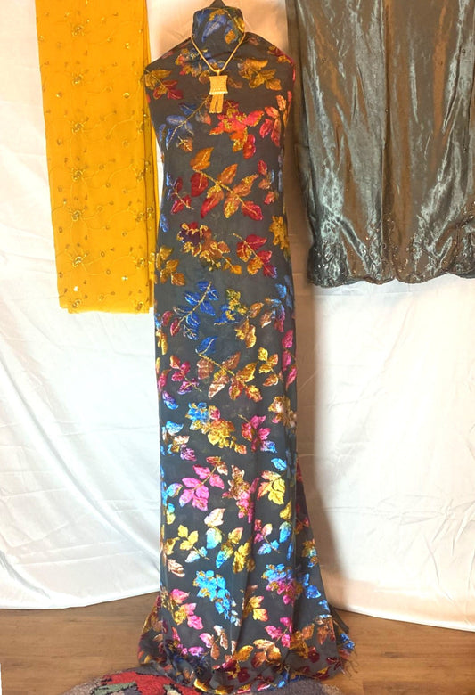 Colorful floral Maqbal Somali Dirac on a mannequin against a white backdrop