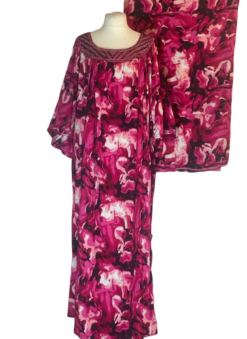 Pink and black patterned outfit on a mannequin against a white background