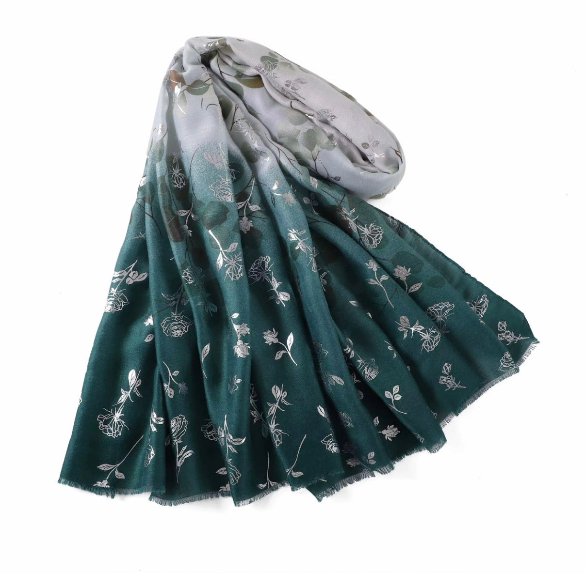 Green floral patterned scarf on a white background