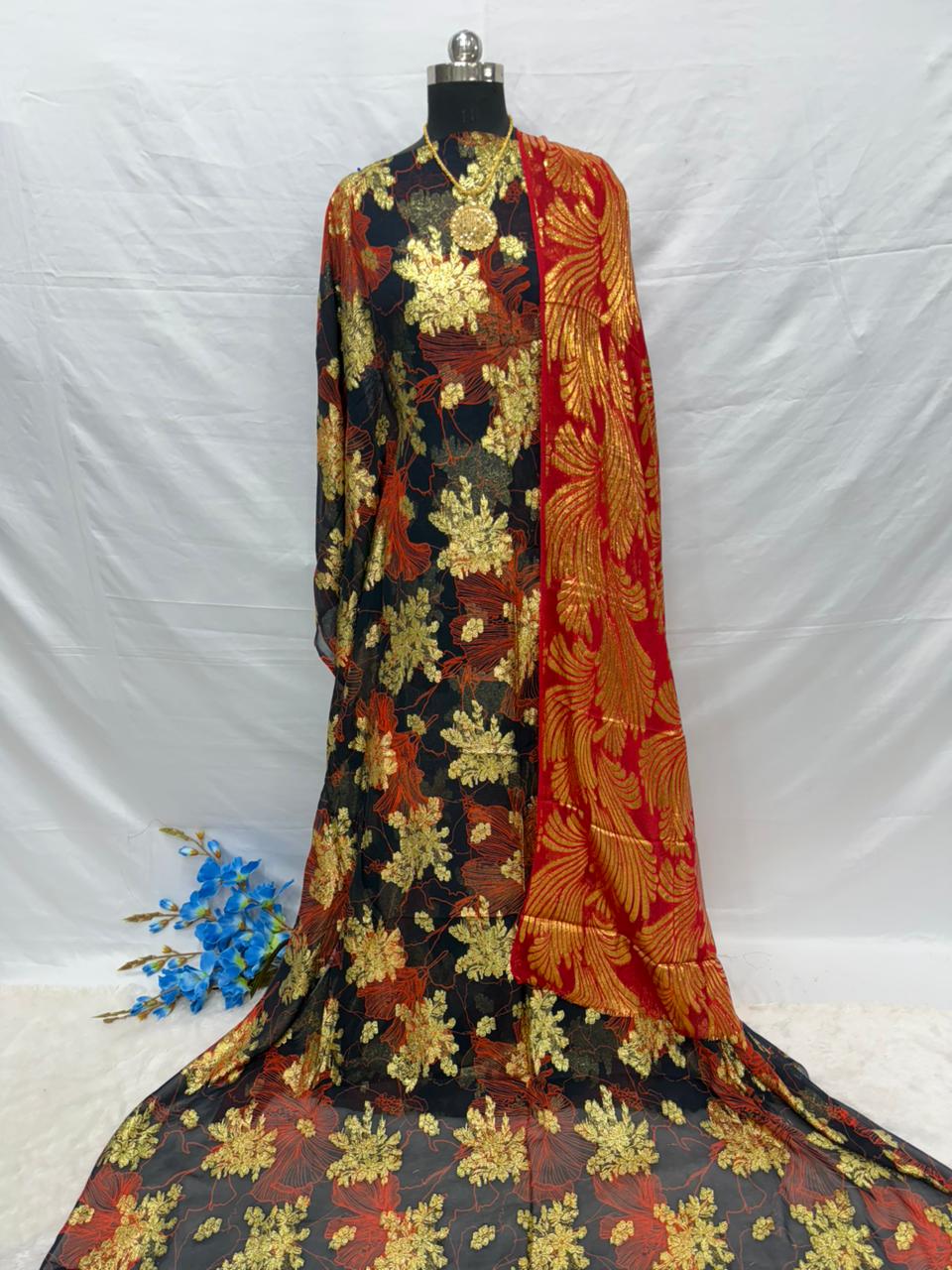 Mannequin wearing a colorful floral Somali dirac Fabric with a white background
