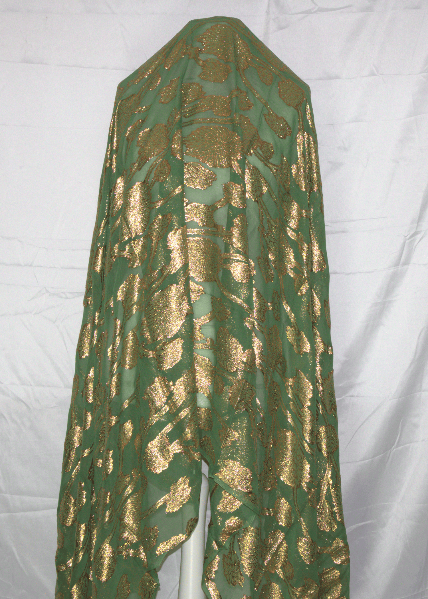 Green Somali Gabsaar with gold pattern on a white background