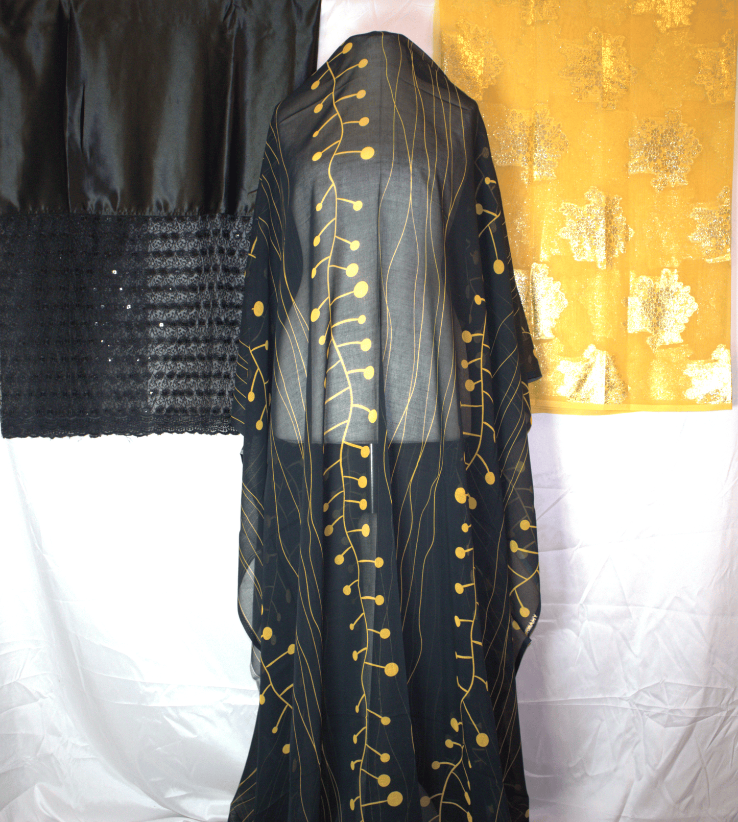 Black German Dirac garment with gold embroidery with Gold Gabsaar on a white background