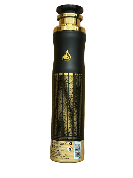 A tall cylindrical bottle with a black body and metallic gold accents, including the cap, collar, and printed text. The bottle is shown from the back, displaying a gold Arabic calligraphy logo and regulatory text, set against a plain white background.