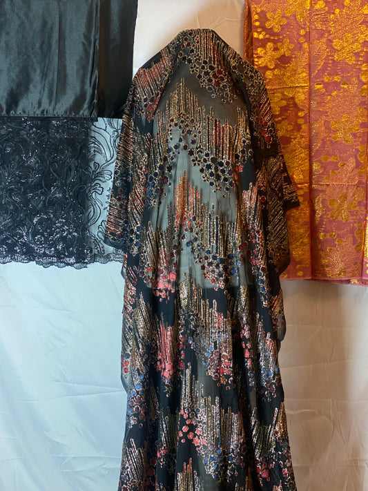 Maqbal dirac fabric with intricate patterns on a plain background