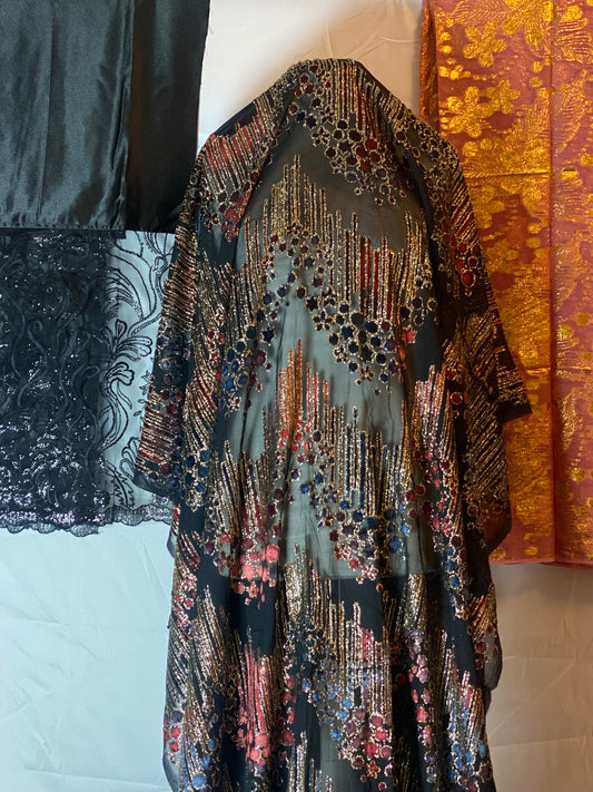 Maqbal Dirac fabric with intricate patterns on a white surface