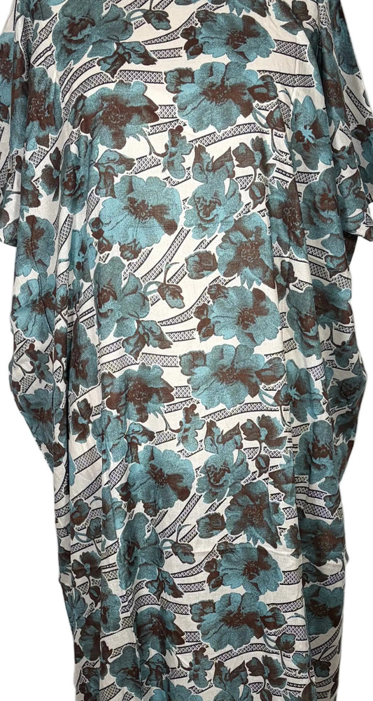 Floral patterned Somali Baati dress on a mannequin against a white curtain background