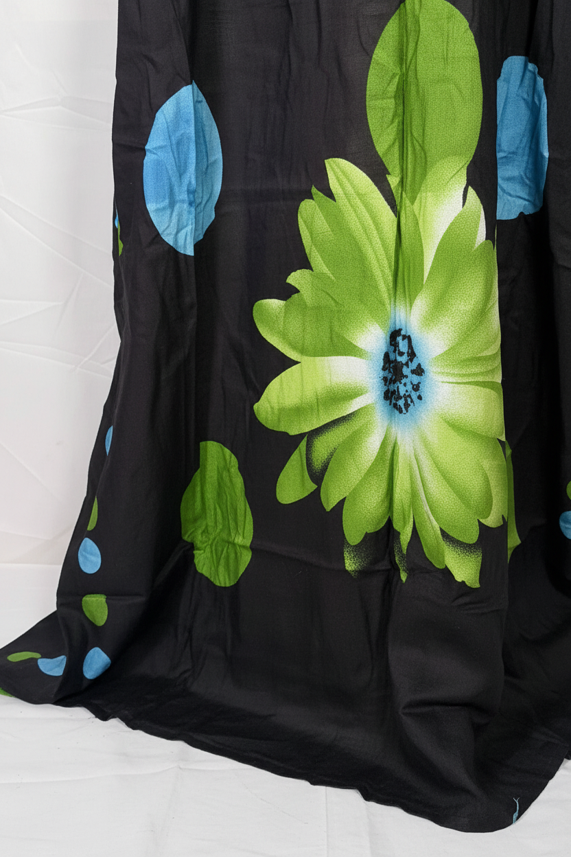 Close-up of black floral Baati hem and fabric drape