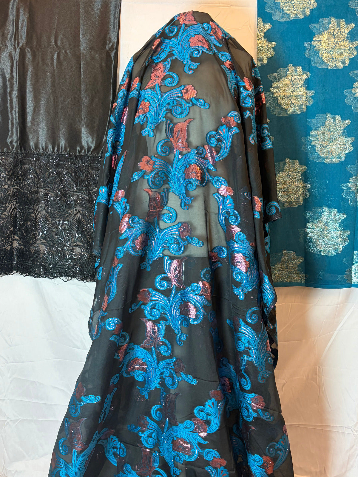 Decorative fabric with blue and red patterns on a plain background