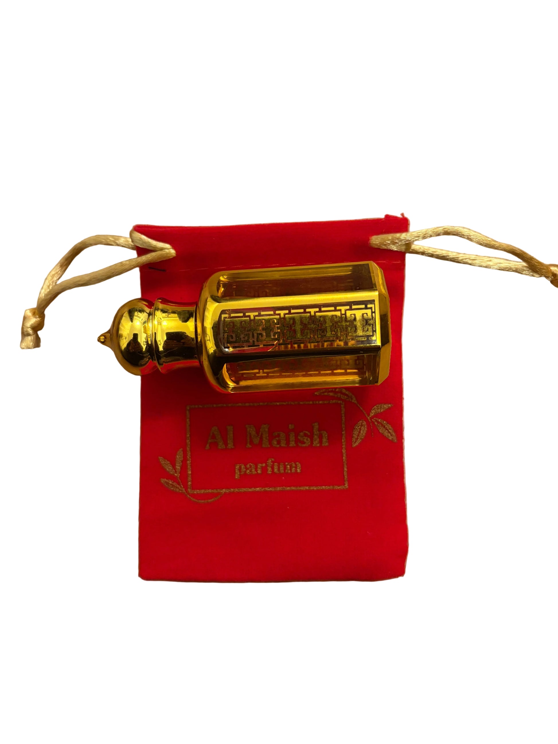 A small gold perfume bottle labeled 'Al Maish parfum' resting on a red drawstring pouch, placed on a light wood surface.