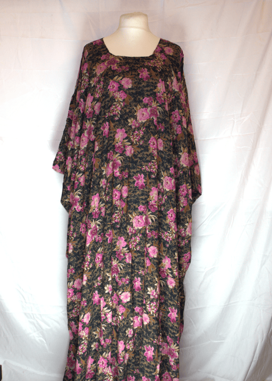 Floral dress on a mannequin against a white background