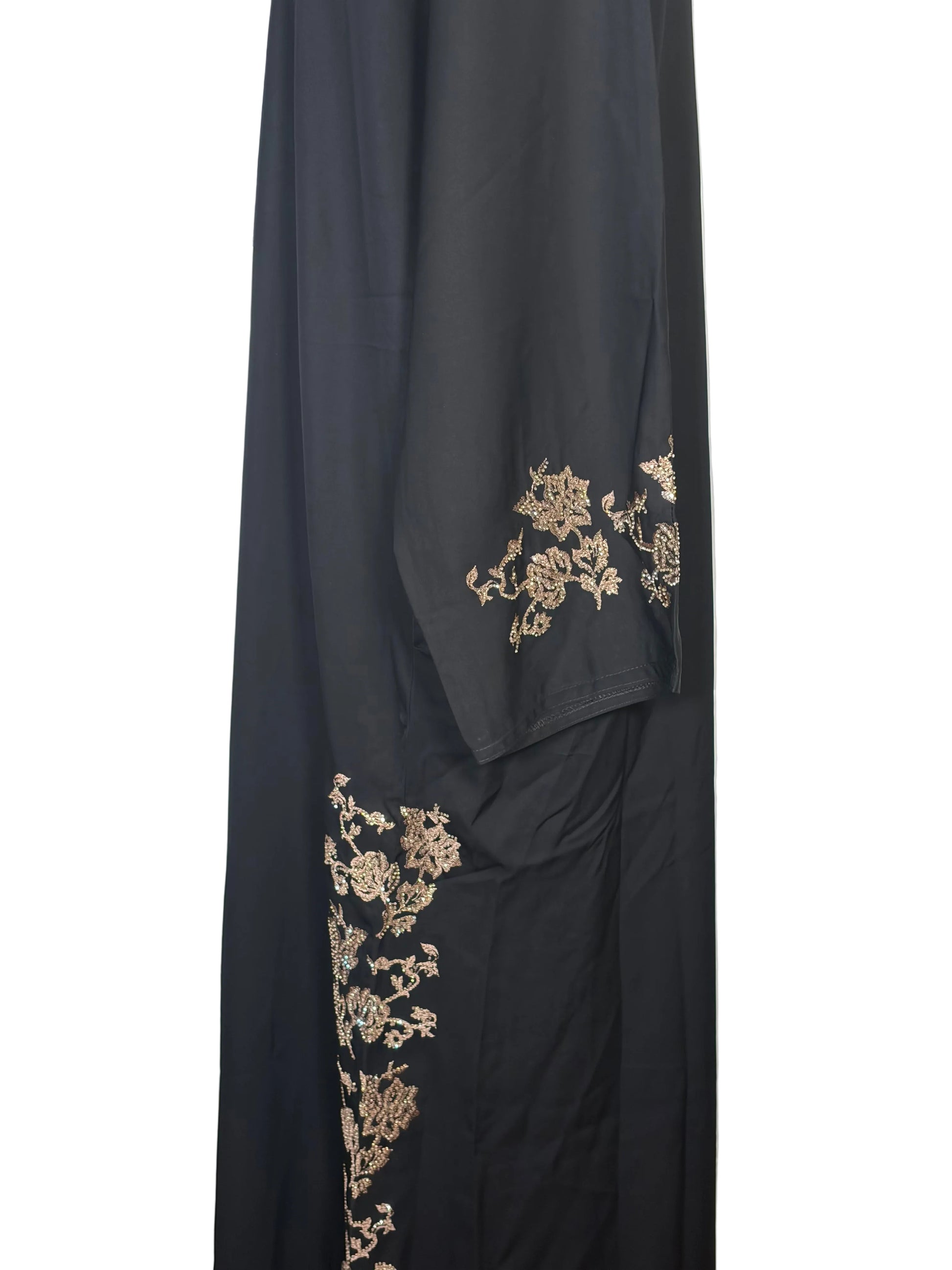 Black fabric with gold embroidery on a white background