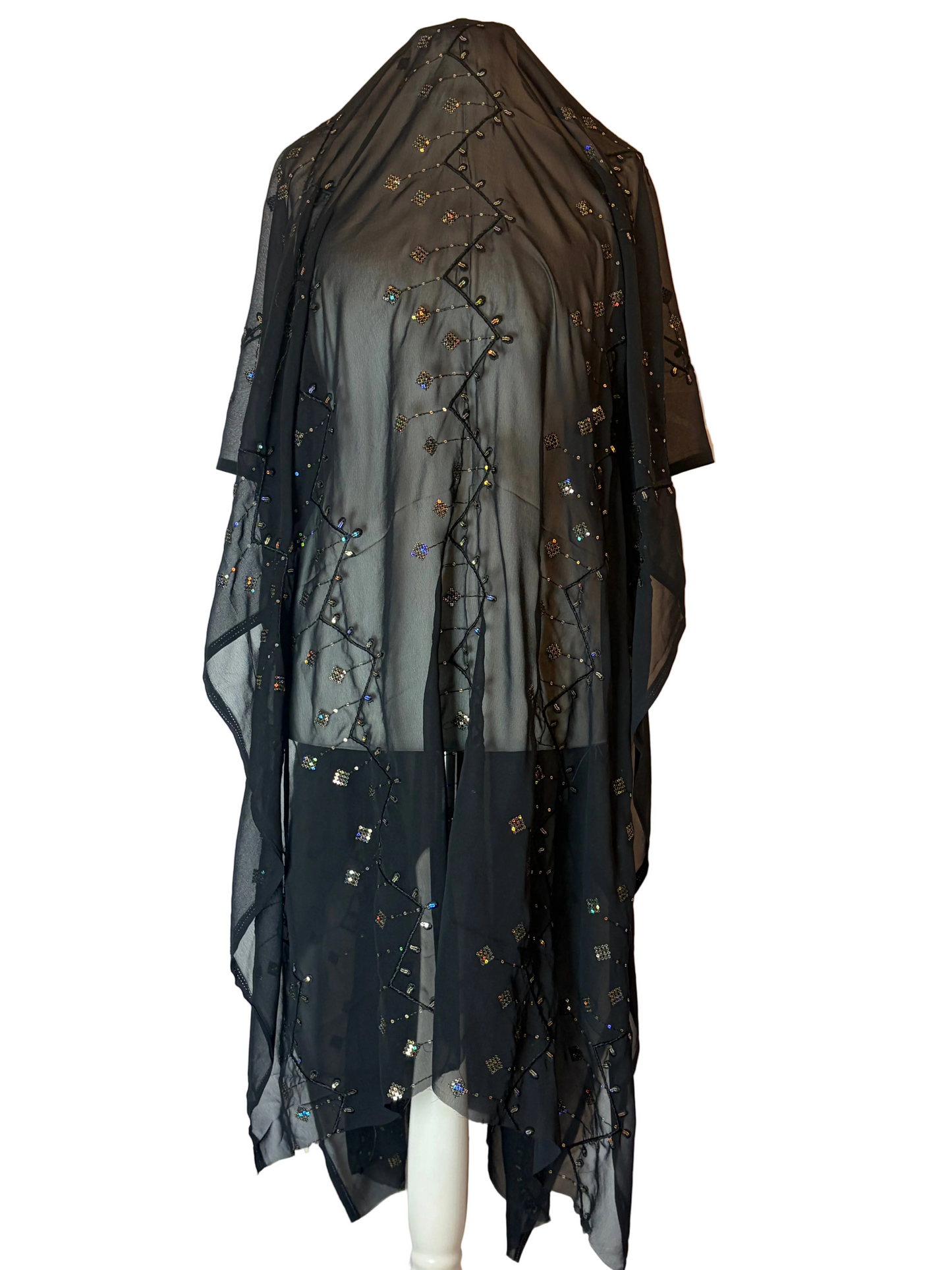 Black Garbasaar garment with embroidered details on a white background