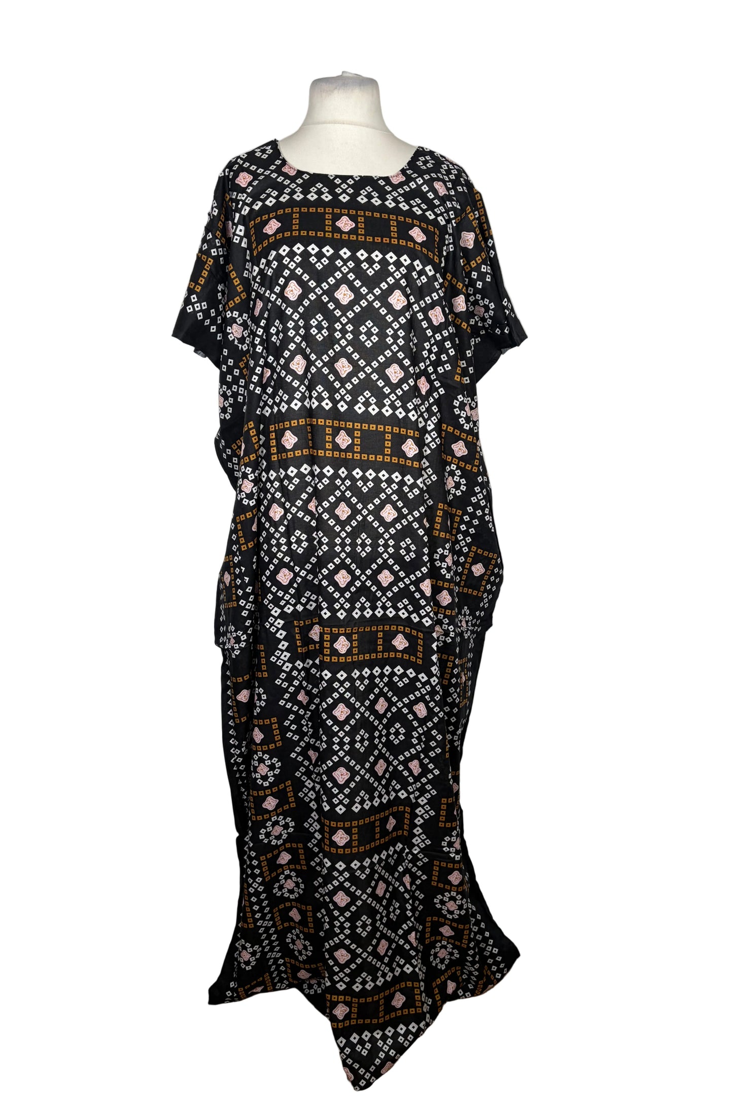 Black patterned Baati dress on a mannequin against a white background