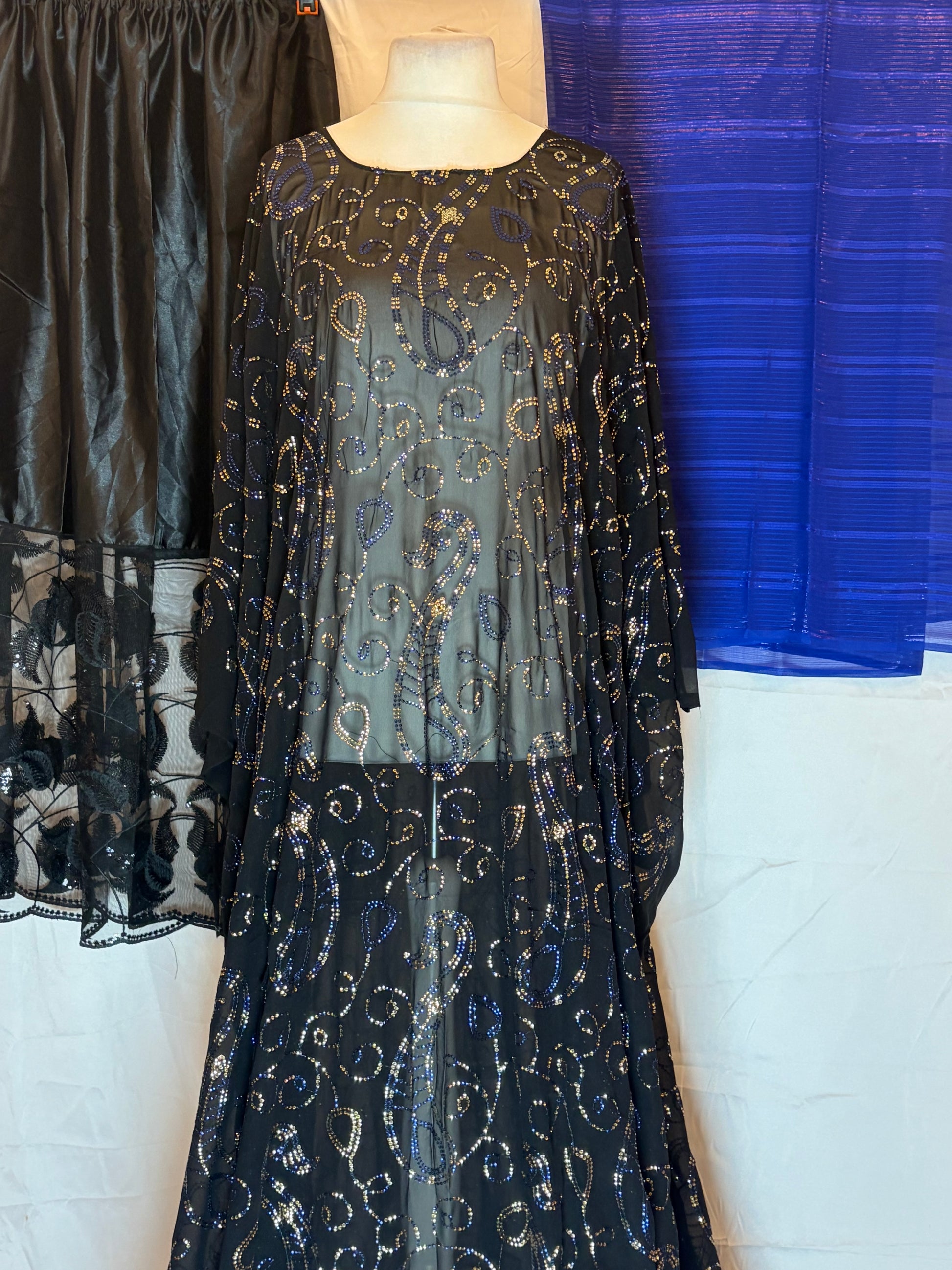 Black Maysa Dirac dress with Garbasaar and gorogard on a white background