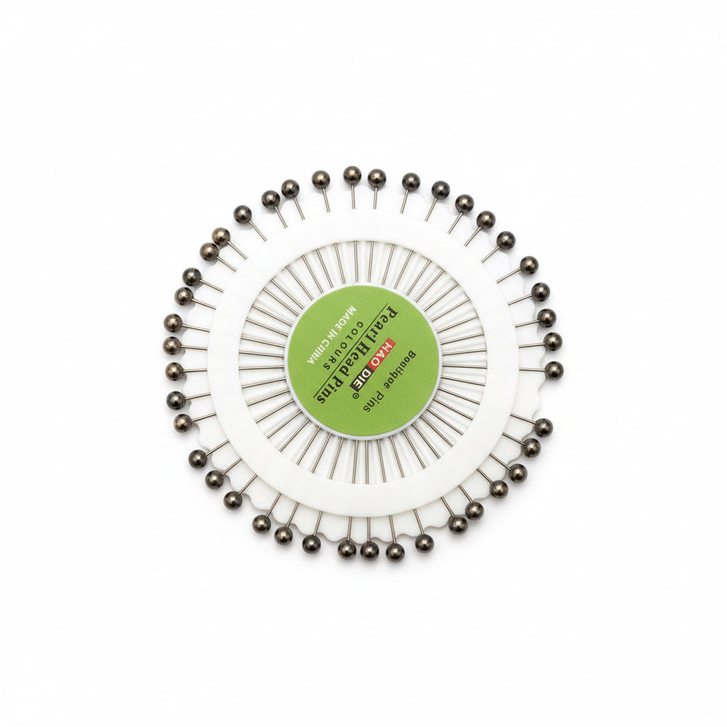 Pack of hijab pins with a circular arrangement on a white background