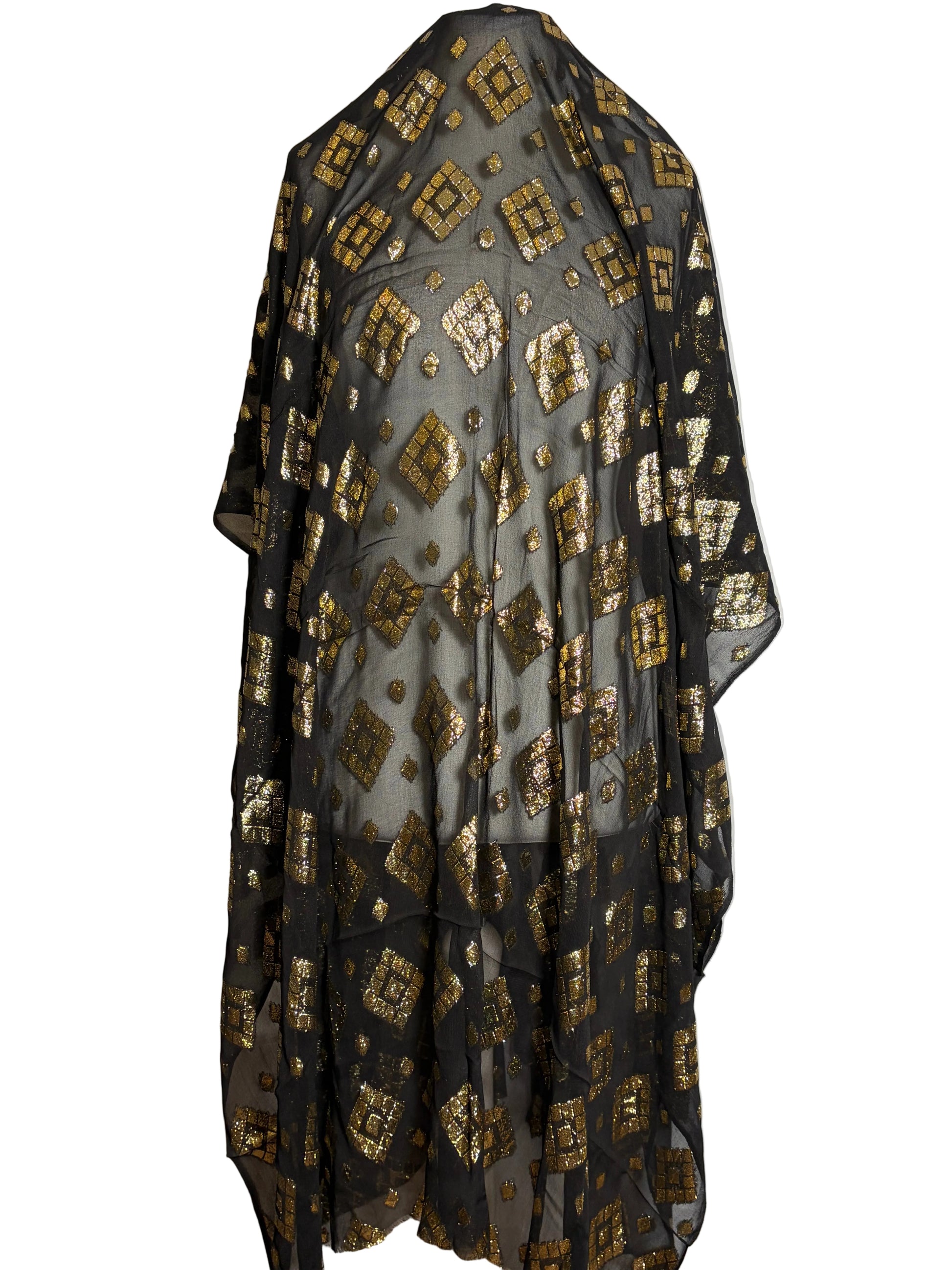 Black and gold patterned Somali garbasaar draped over a white background