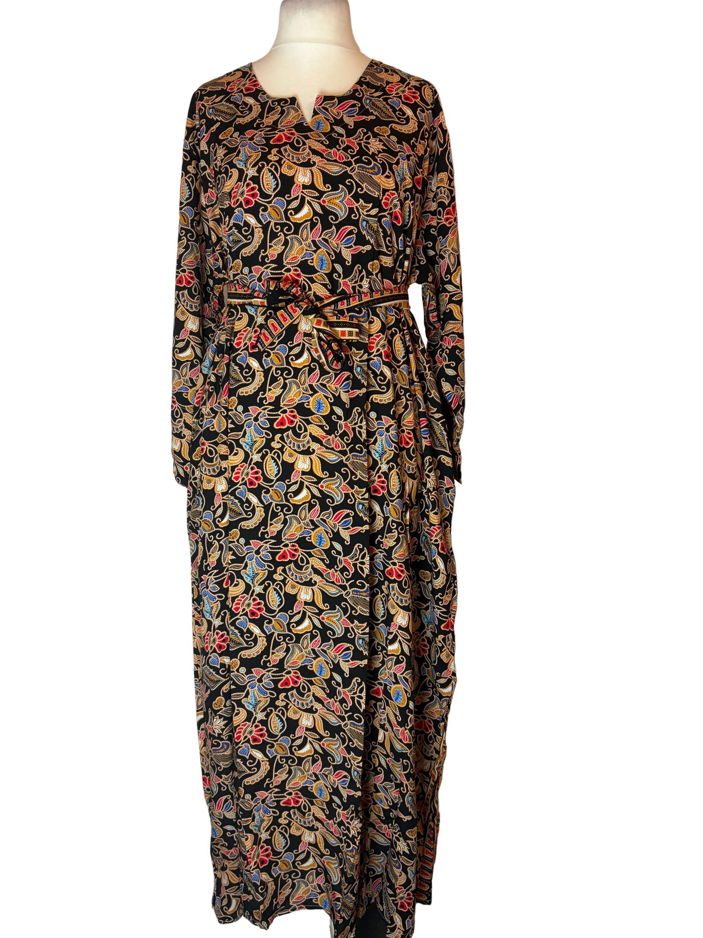Long-sleeve dress with a colorful pattern on a mannequin against a white background