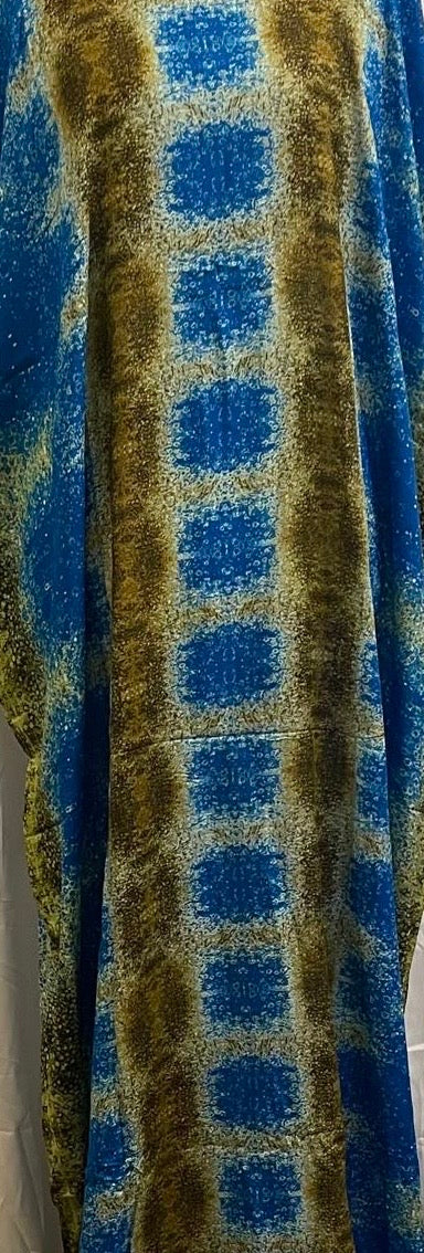 Plaid Somali baati fabric with blue and green pattern on a plain background