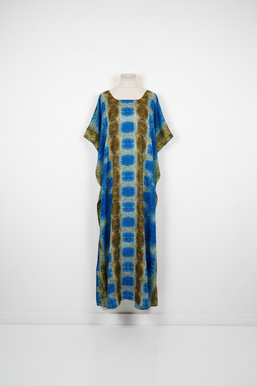 Long Somali baati dress with blue and green pattern on a mannequin against a white background