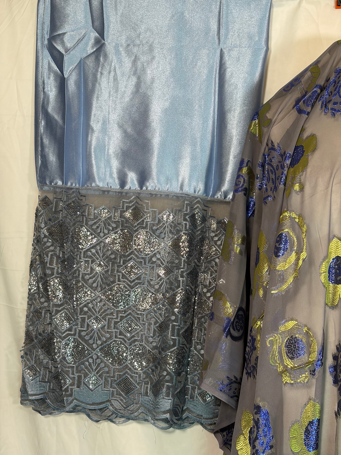 Fabric swatches in various patterns and colors on a bed