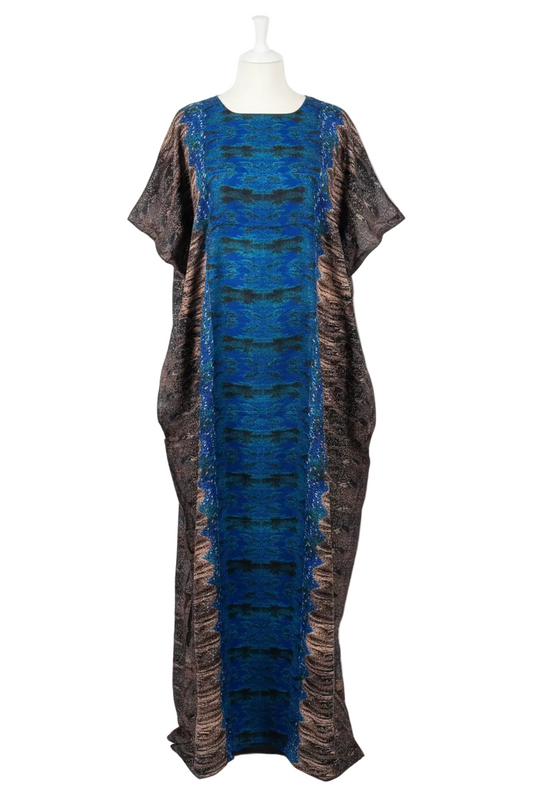 Long, patterned Somali Baati dress on a mannequin against a white background