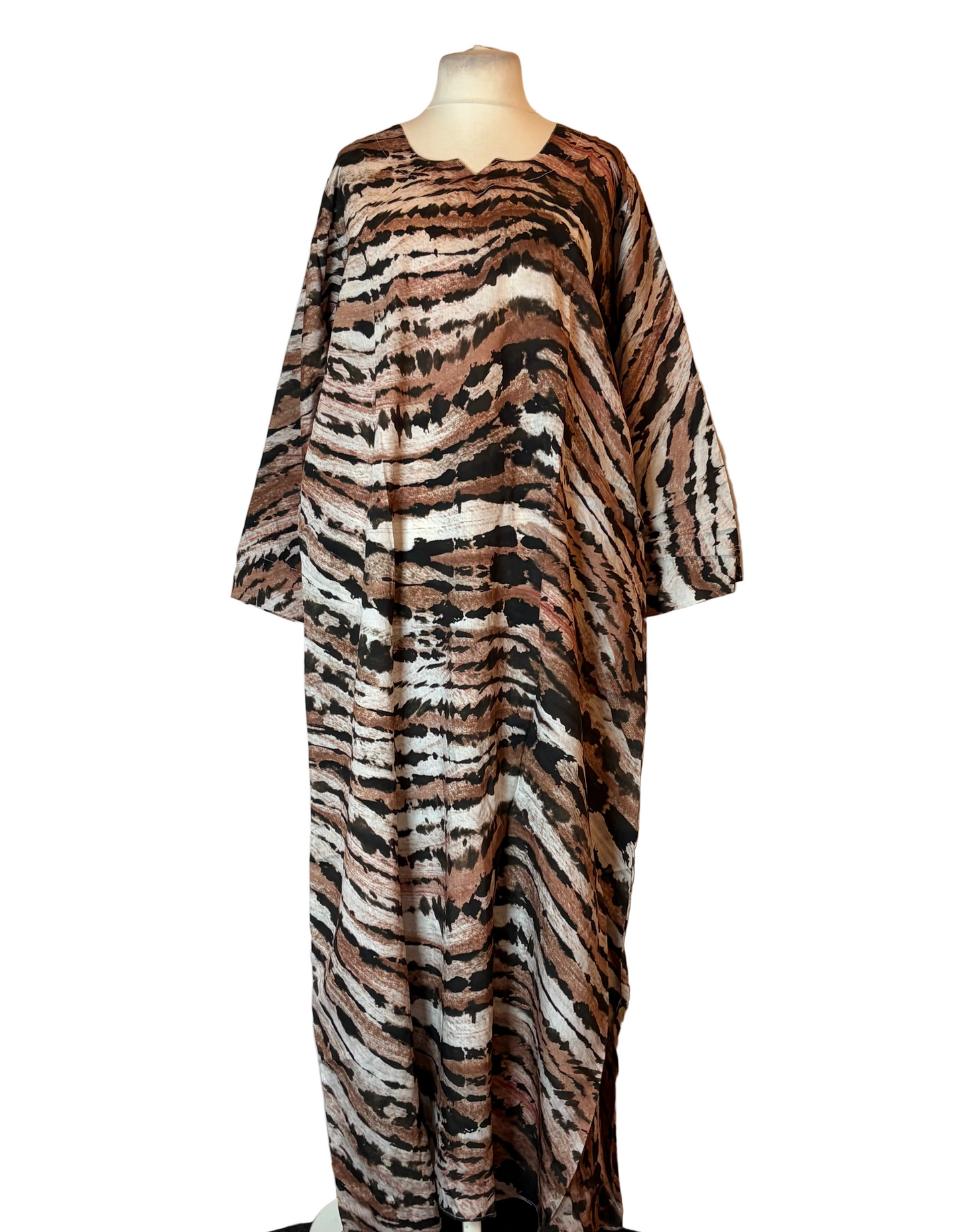 Zebra print dress on a mannequin against a plain background