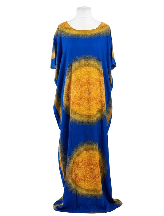 Mannequin wearing a blue and yellow dress with a circular pattern on a white background