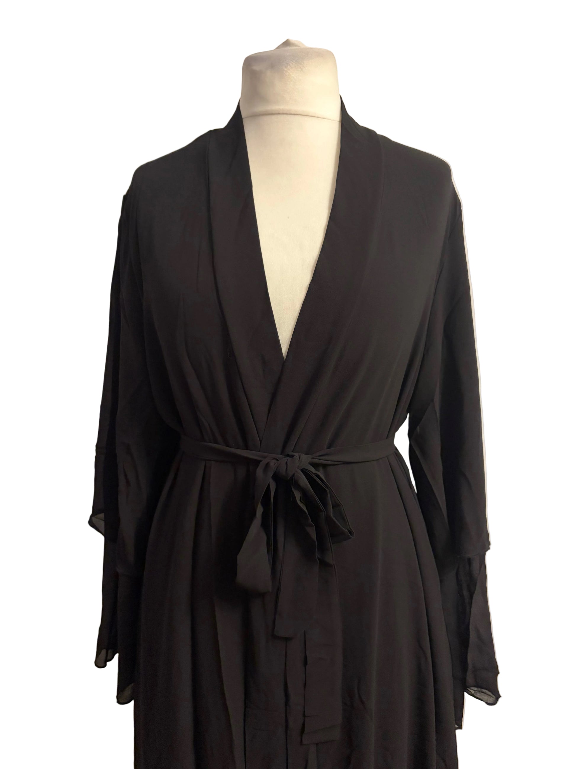 Black robe on a mannequin against a white background