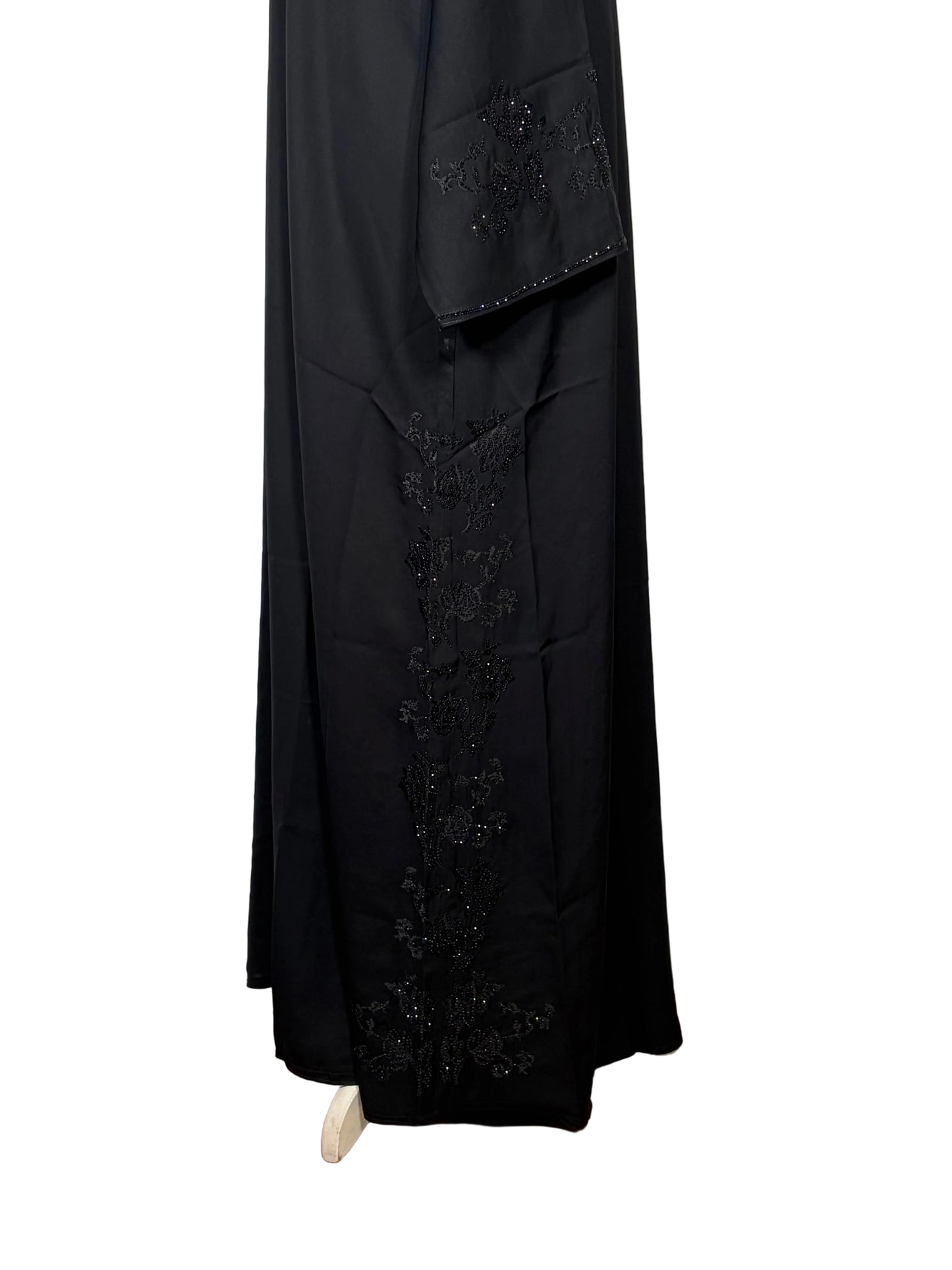 Black Open abaya dress on a white surface 