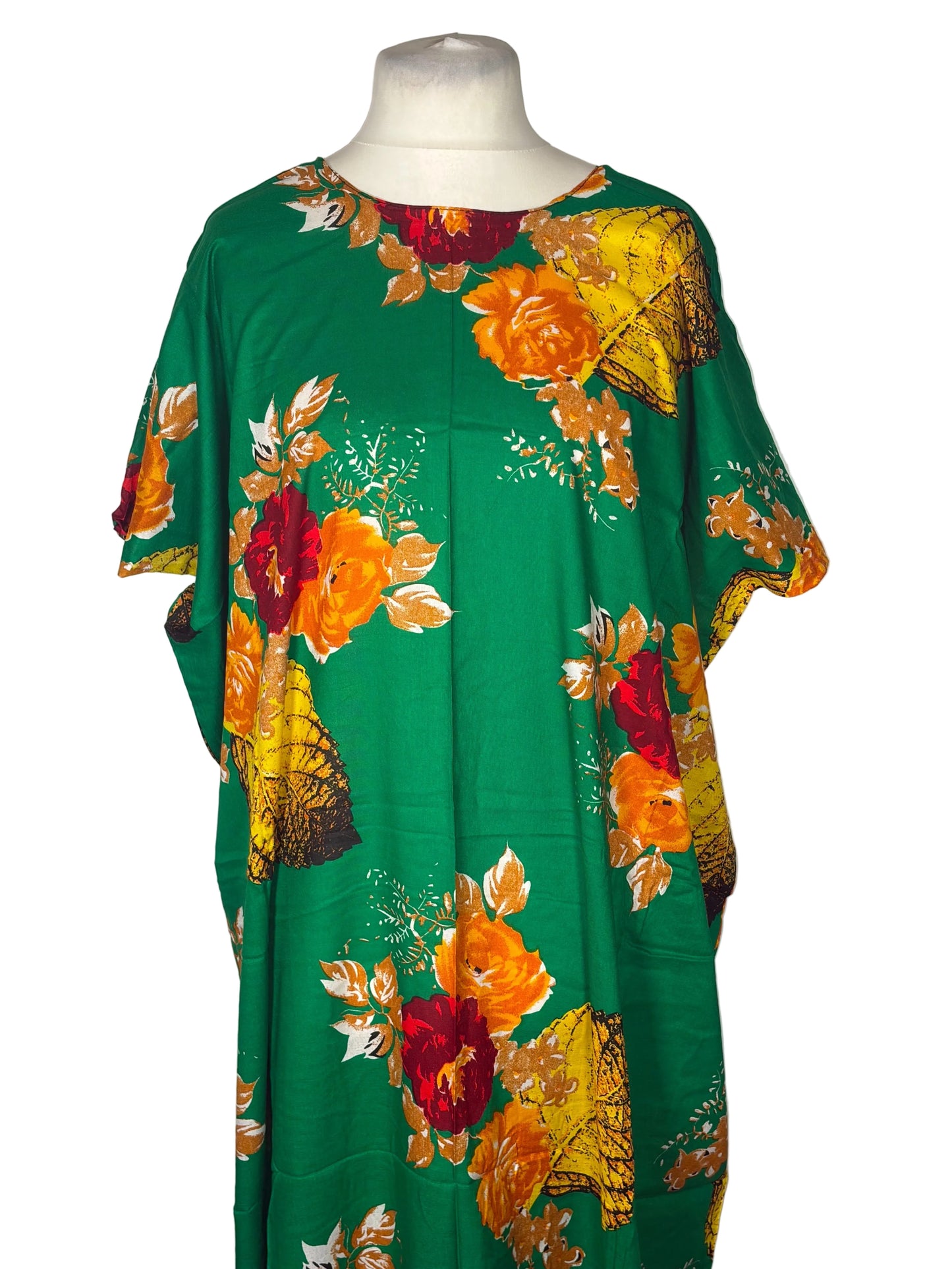 Green Somali baati with colorful floral pattern on a mannequin against a white background