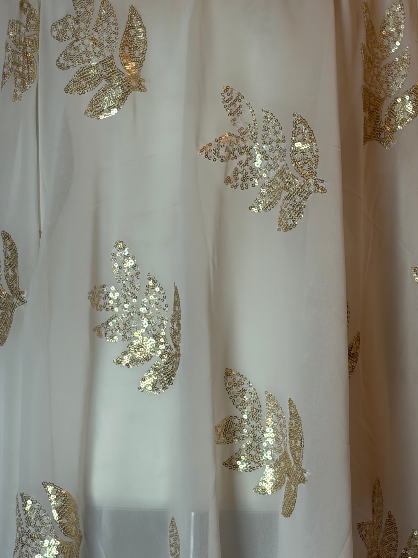 White Somali Garbasaar fabric with gold sequin floral patterns