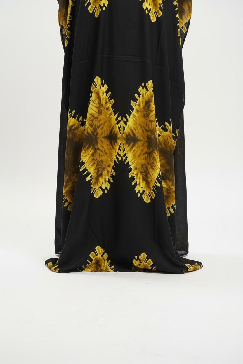 Black Somali baati dress with gold floral patterns on a white background