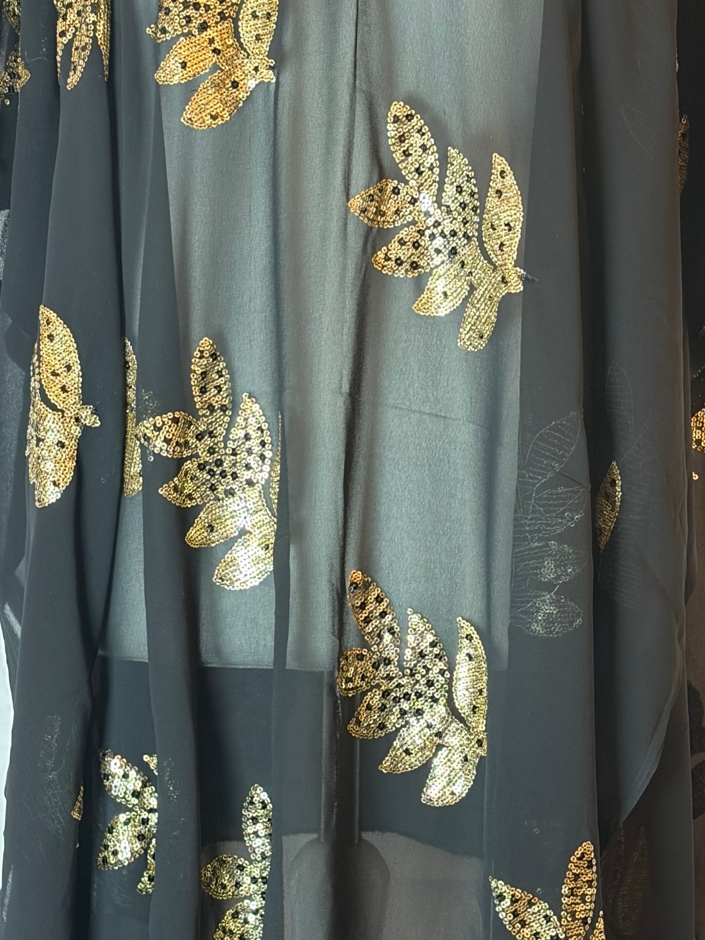Black Somali Garbasaar fabric with gold leaf patterns
