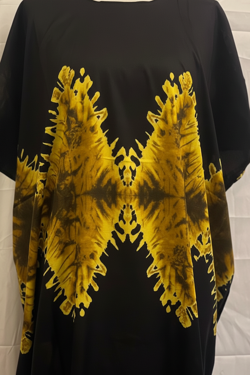 Black t-shirt with yellow tie-dye design on a white background