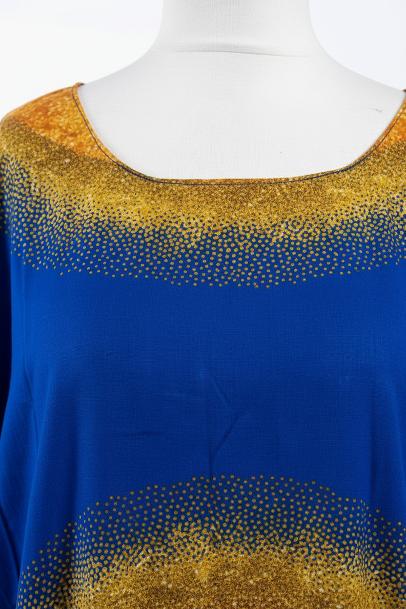 Blue top with gold embellishments on a mannequin