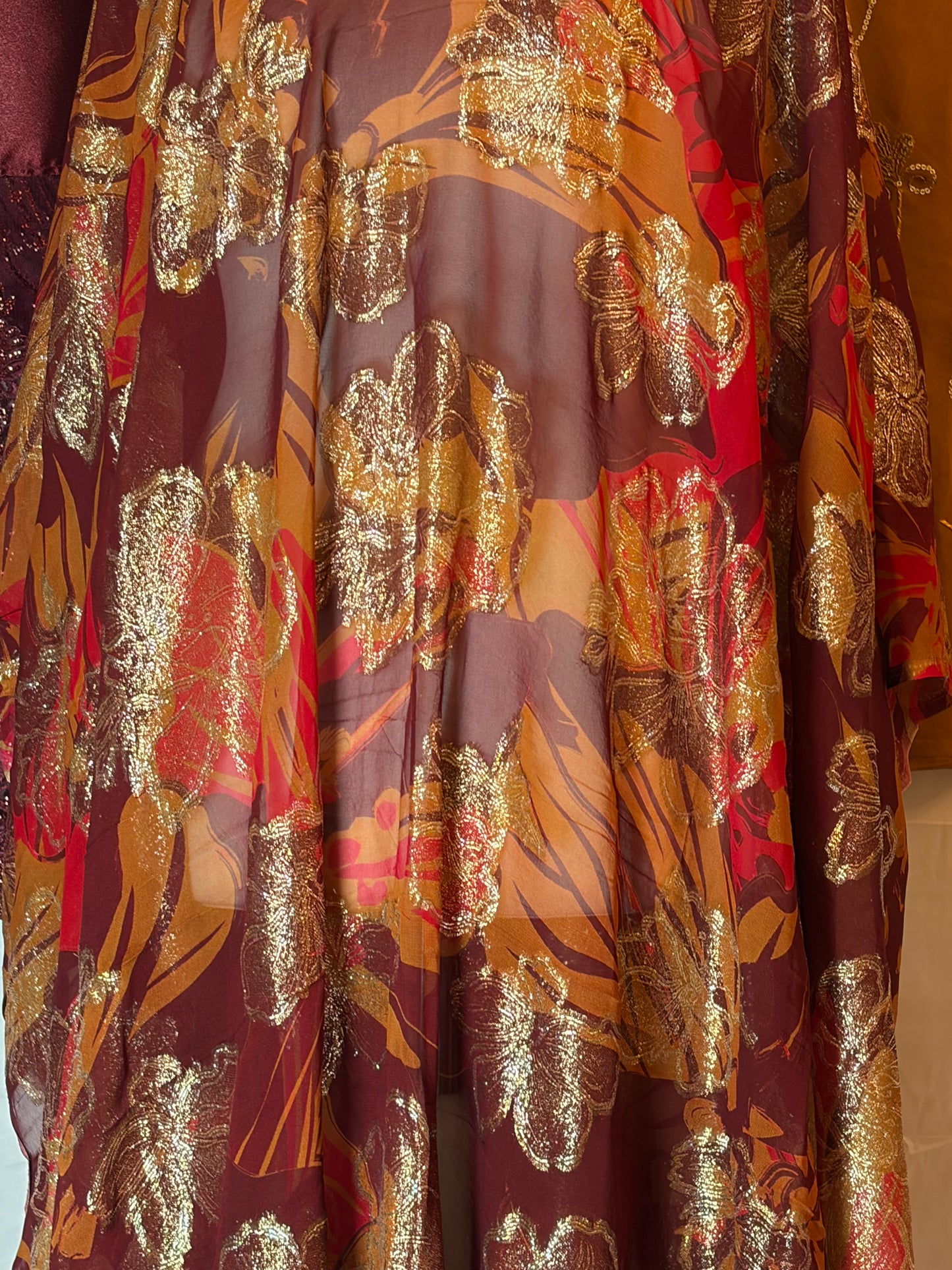 Stack of patterned fabric with gold and red colors