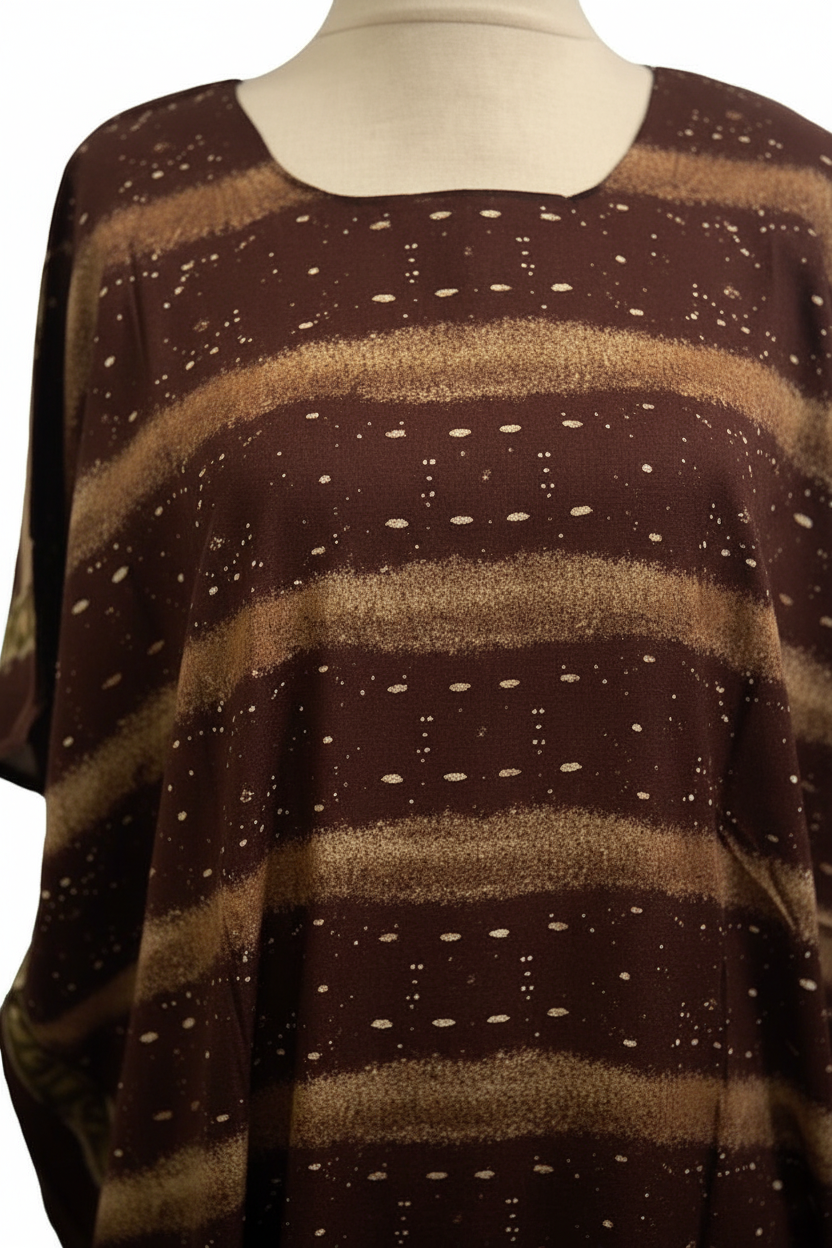 Brown and beige striped baati dress on a mannequin