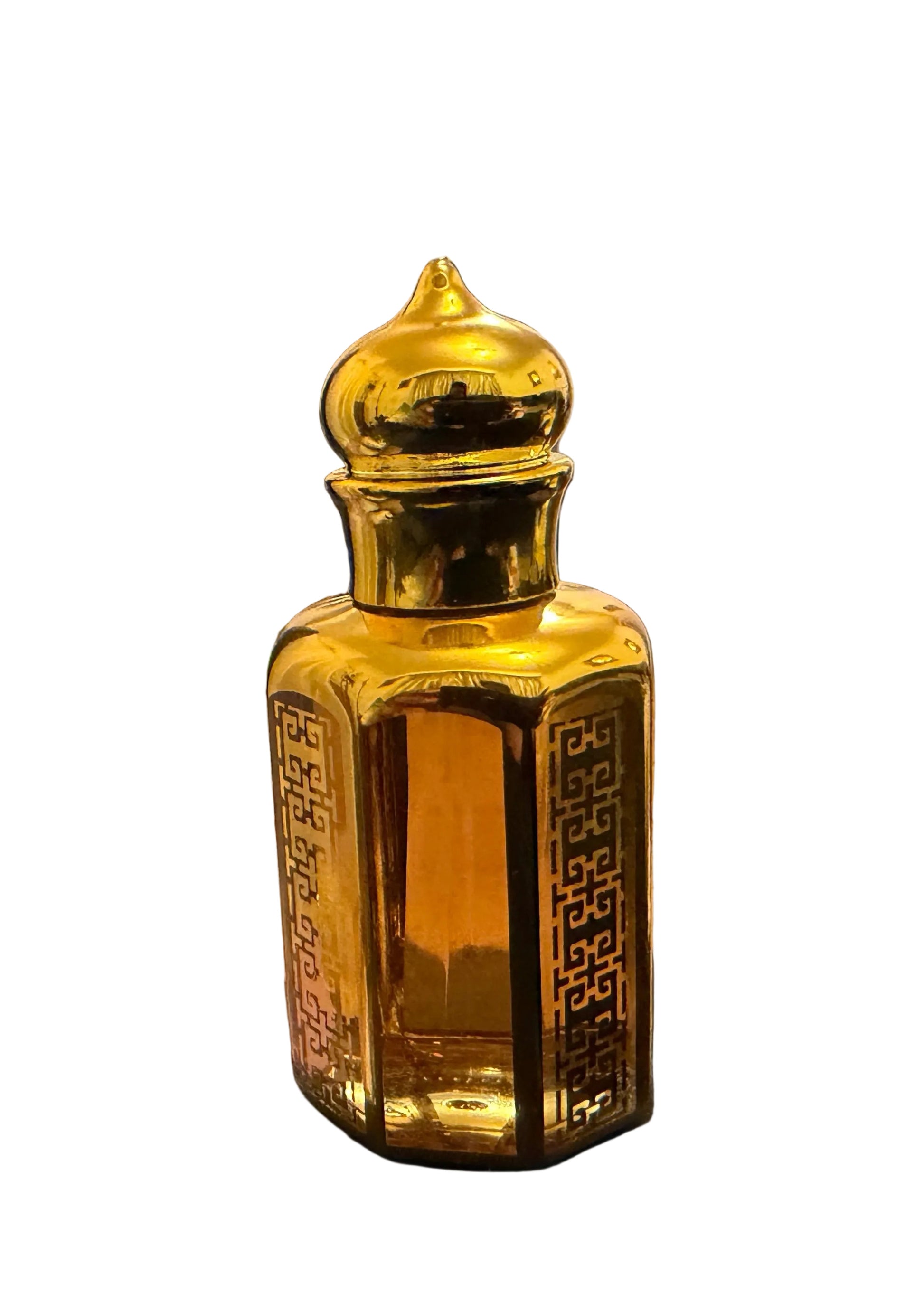 A small ornate golden bottle with a domed lid and decorative cutout sides, placed on a dark surface in a home office or room setting with a desk chair, wood floor, and door in the background.
