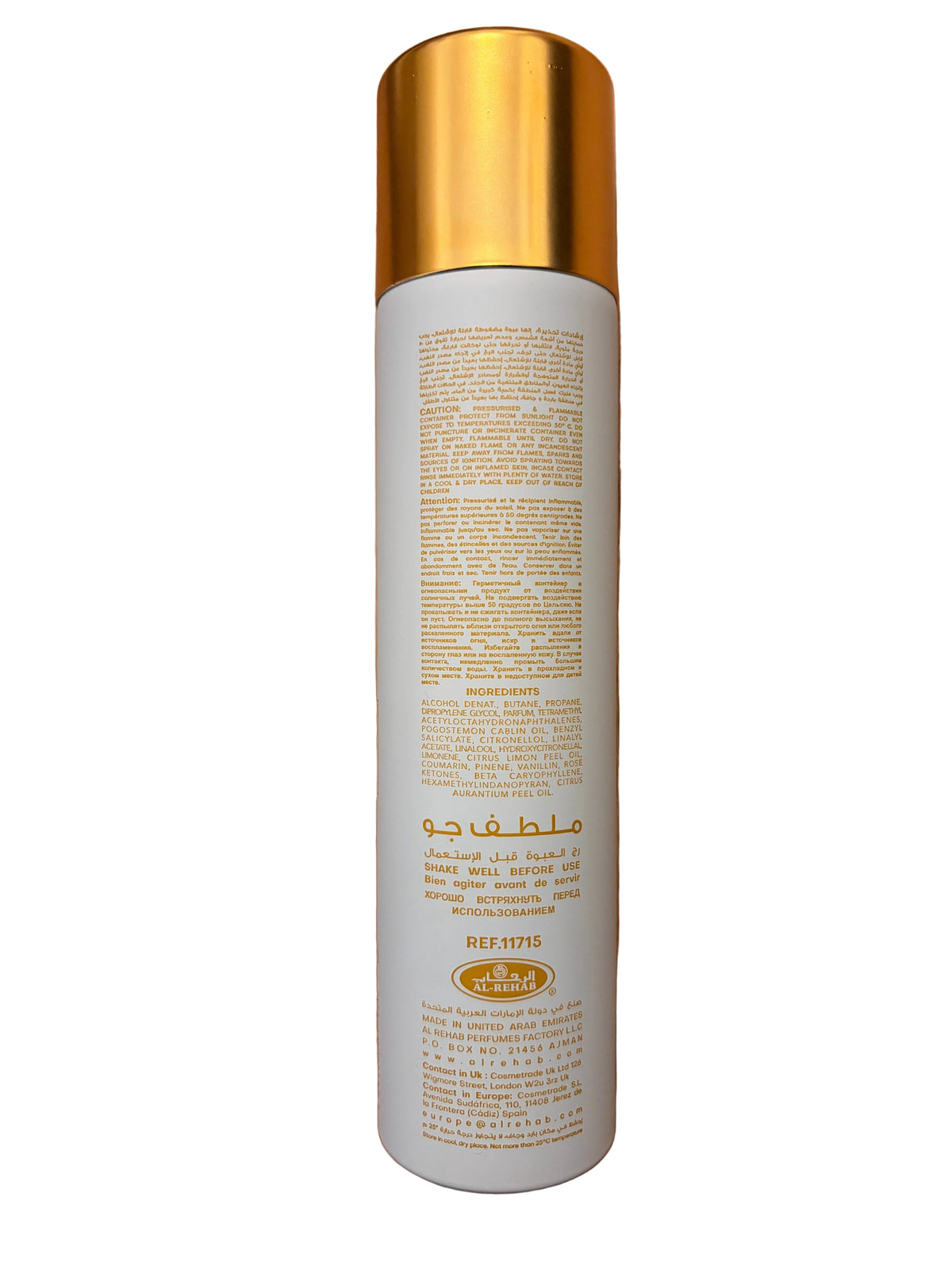 A tall white cylindrical bottle with a metallic gold cap, photographed from above on a wooden surface. The bottle has Arabic text printed in gold on the front and back, along with a small circular logo near the bottom.