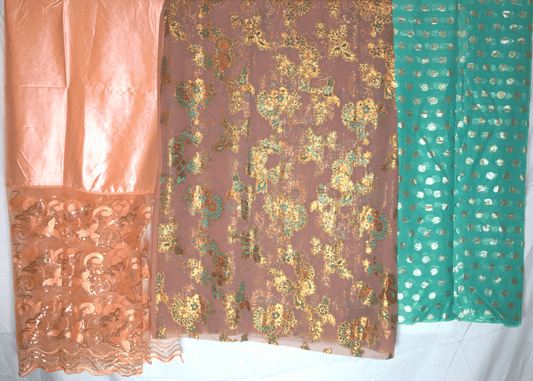 Three pieces of fabric with different patterns and colors 