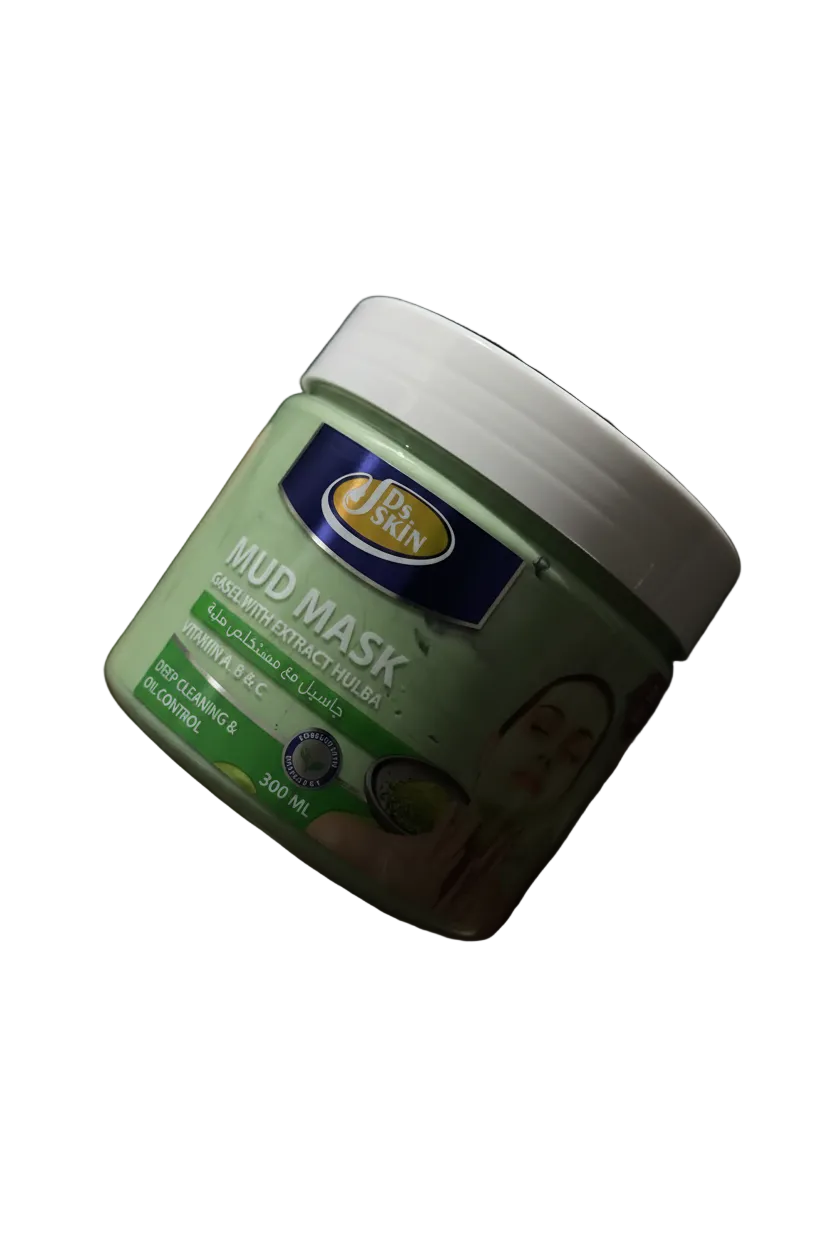 A hand holding a jar of Jeevan Mud Mask against a dark, shadowed background.