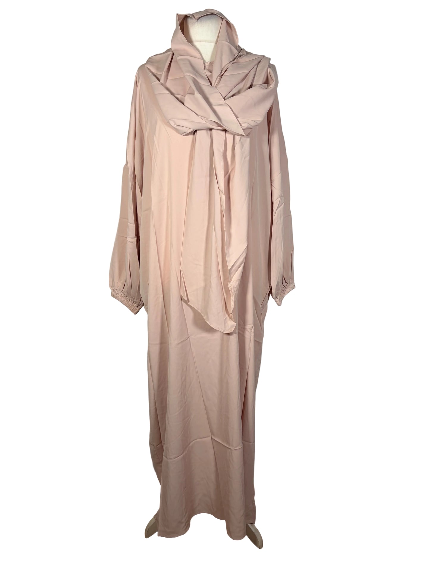 Beige Abaya dress on a mannequin against a white backdrop