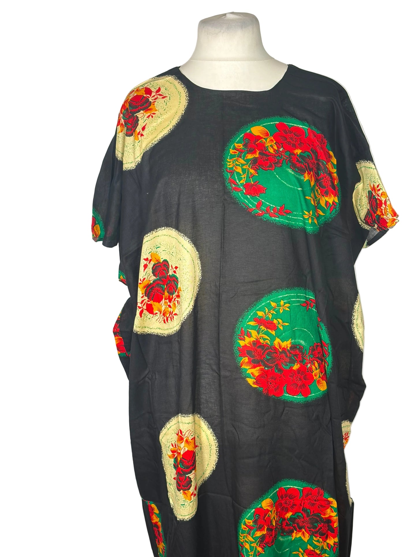 Black Somali Baati with colorful floral patches on a white background