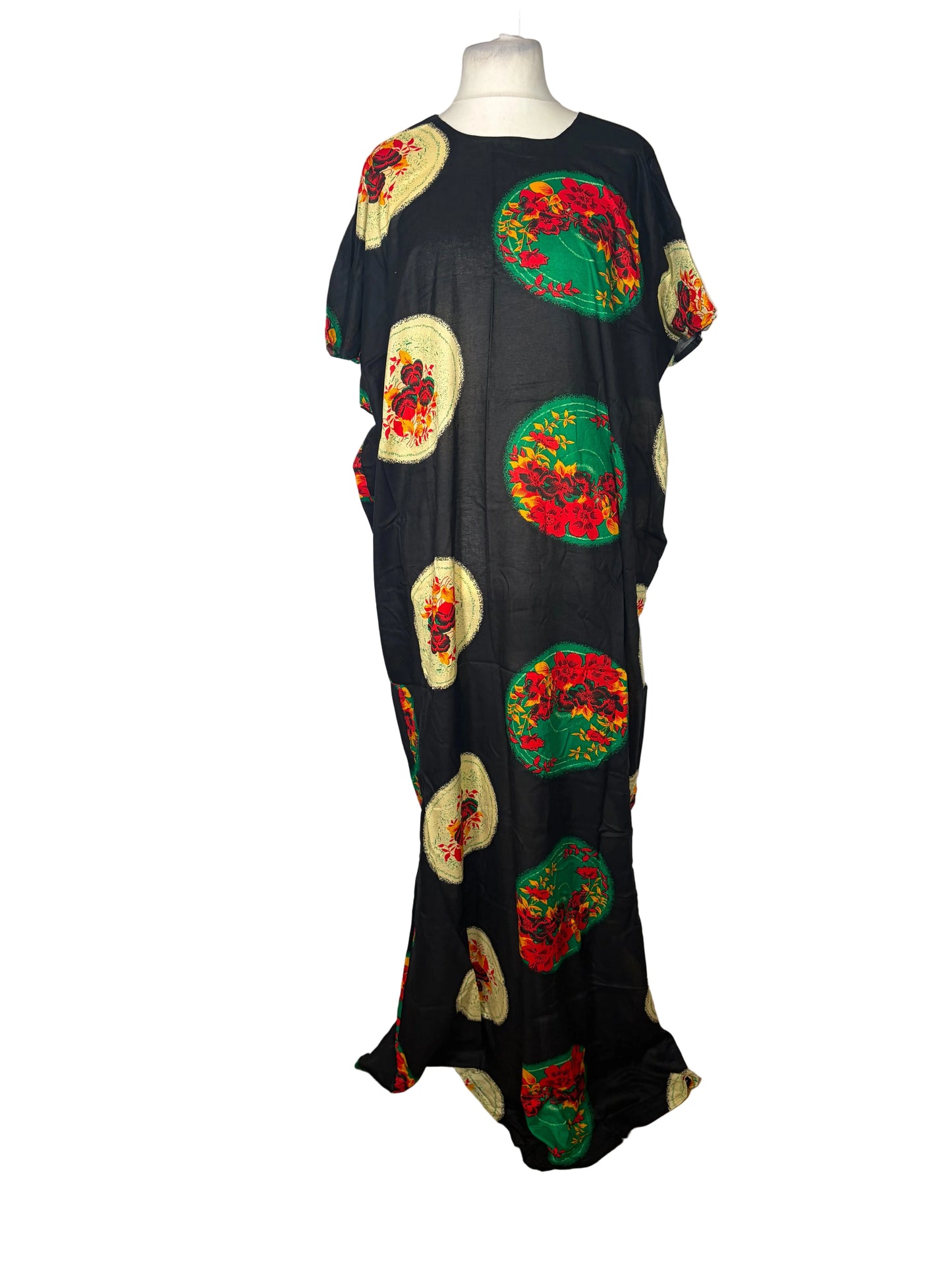 Black Somali Baati with colorful floral patterns on a mannequin against a white backdrop.