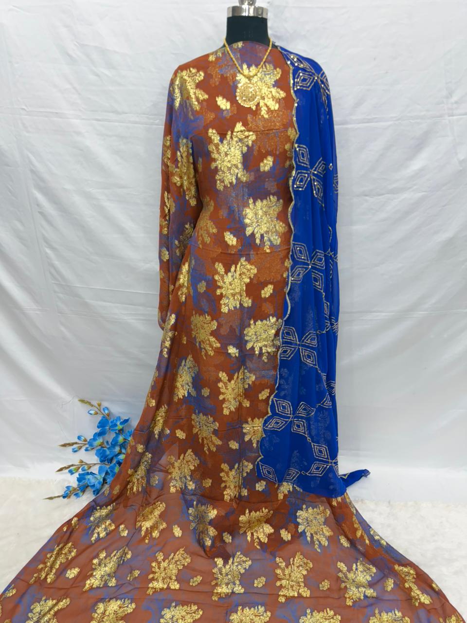 Colorful Somali Dirac fabric with gold floral patterns on a white background